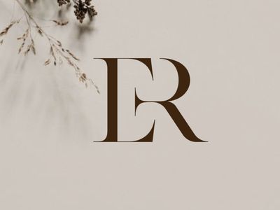 the letter r is surrounded by dried flowers