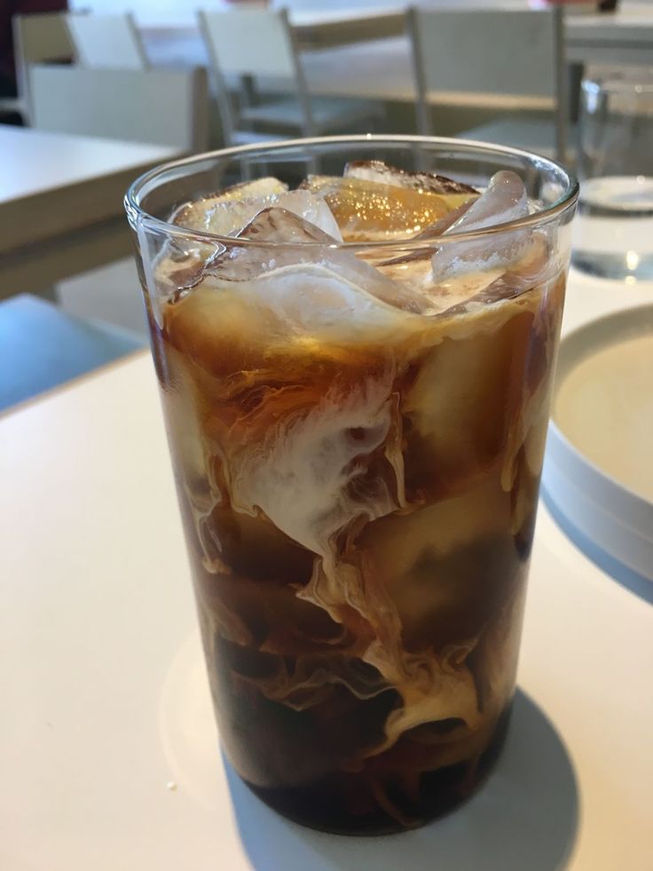 an iced drink with ice sits on a table