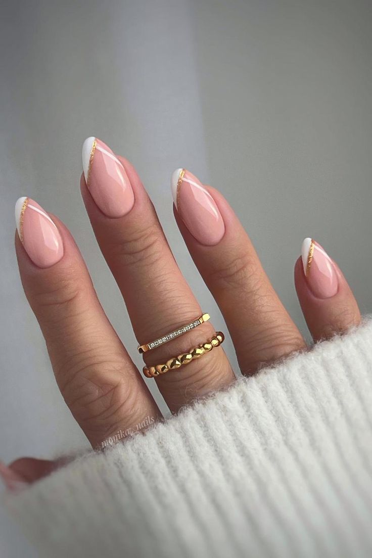 Timeless Glamour: Almond-shaped nails in delicate pale pink embrace sophistication, harmonized with a diagonal white French tip adorned with a touch of gold foil, radiating subtle luxury. // Photo Credit: Instagram @monika__nails Almond Nails, Nail Ideas, Holiday Nail Designs, Nails Inspiration, Uñas, Nail Inspo, Nail Colors, Diagonal Nails, Almond Shape Nails