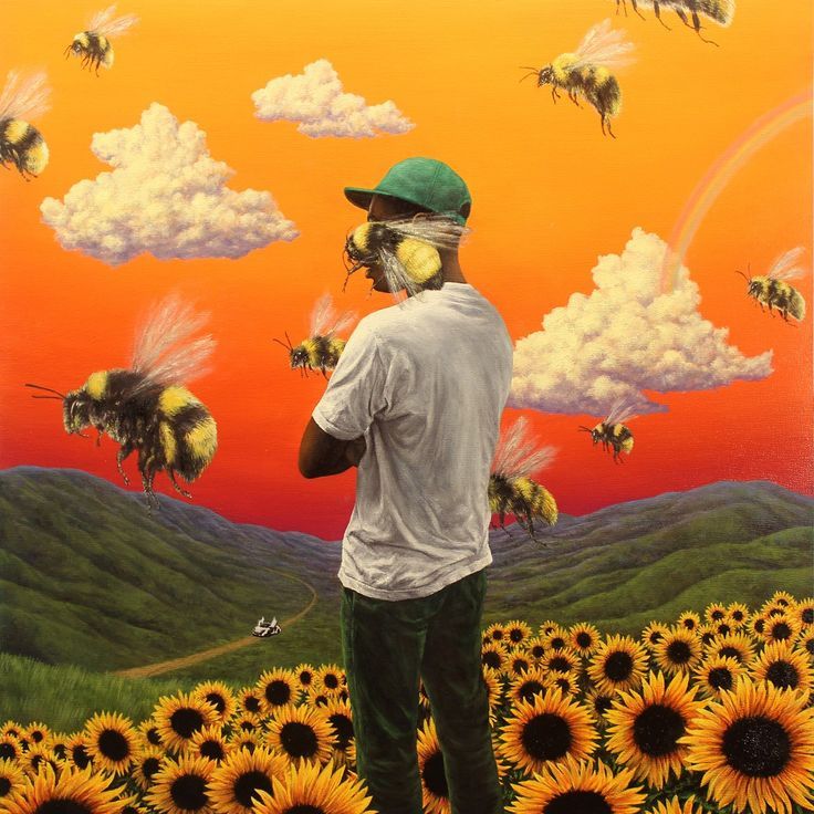 a man standing in front of a field of sunflowers with bees flying around