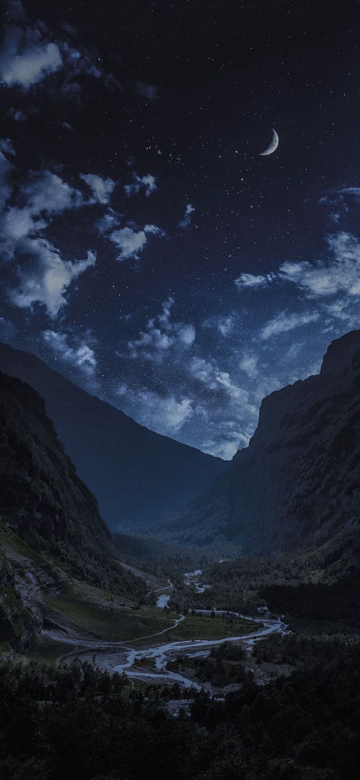 the night sky is full of stars and clouds over a mountain valley with a river running through it