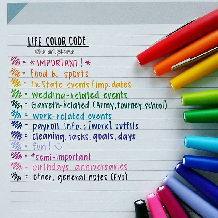 several different colored pens sitting on top of a piece of paper with the words life color code written in it