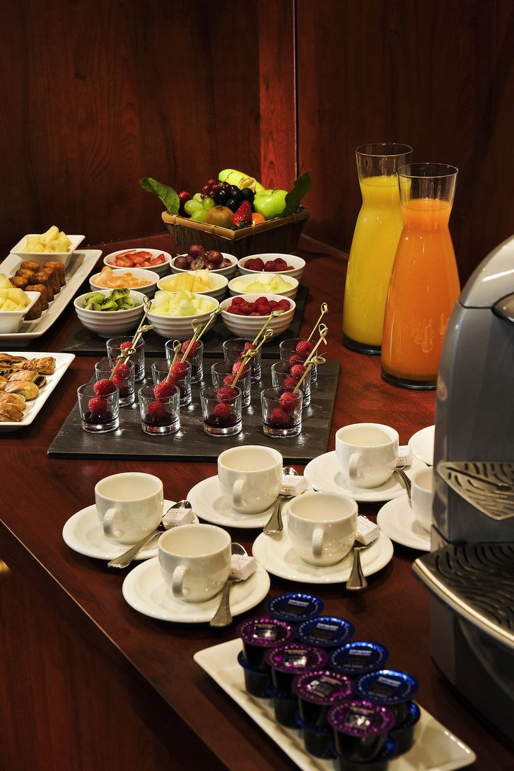 the breakfast buffet is ready to be eaten and served for two or four people at this hotel