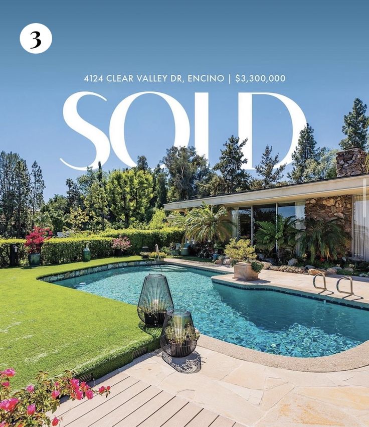 the front cover of a magazine with a pool and landscaping area in the foreground