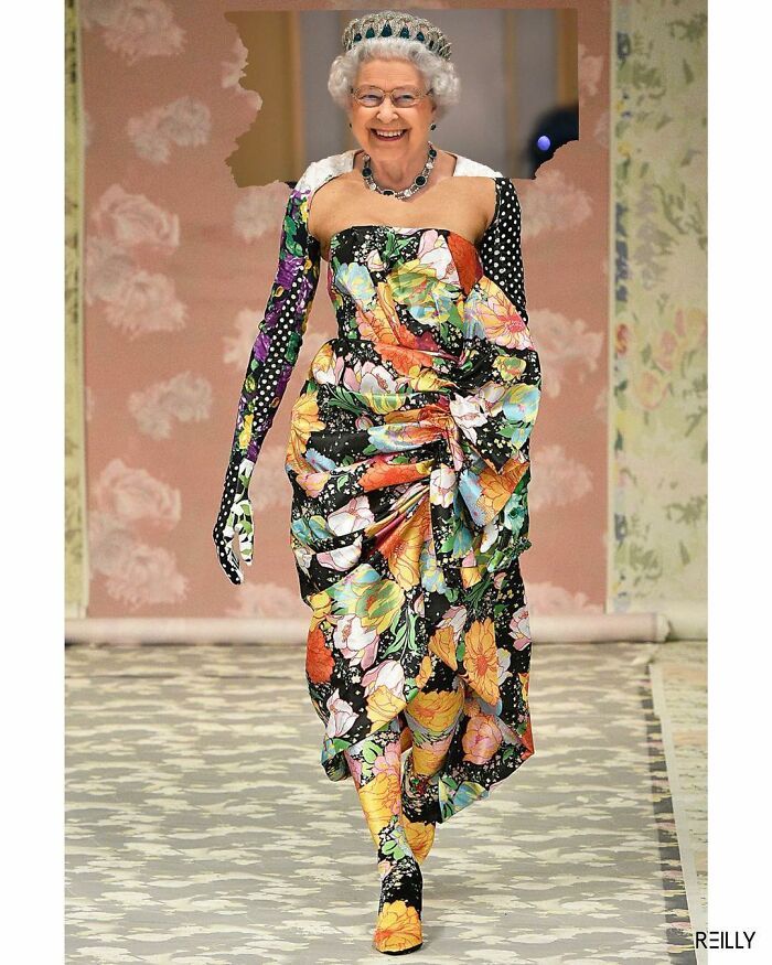 an older woman walking down a runway wearing a dress with flowers on the front and sides