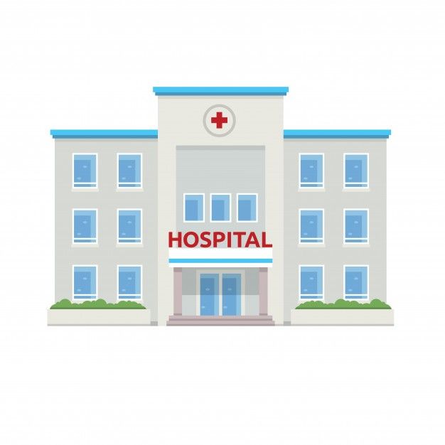 a hospital building with a red cross on the front