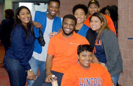 Students from Lincoln University, P.A., smiling and posing together at a campus event, showcasing university spirit in their attire.