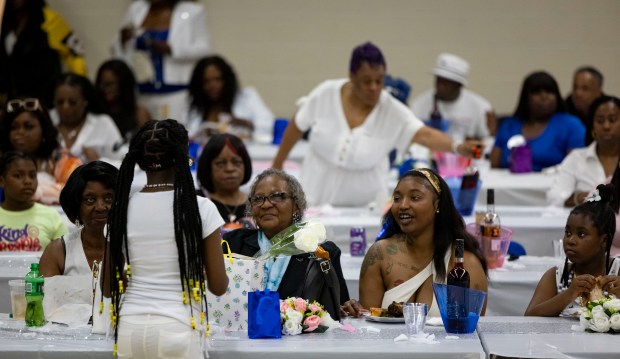 Mothers and family members socialize on May 12, 2024, during the 4th annual Heal Your Heart Mother's Day event at St. Elizabeth's Hall in Bronzeville. (Brian Cassella/Chicago Tribune)