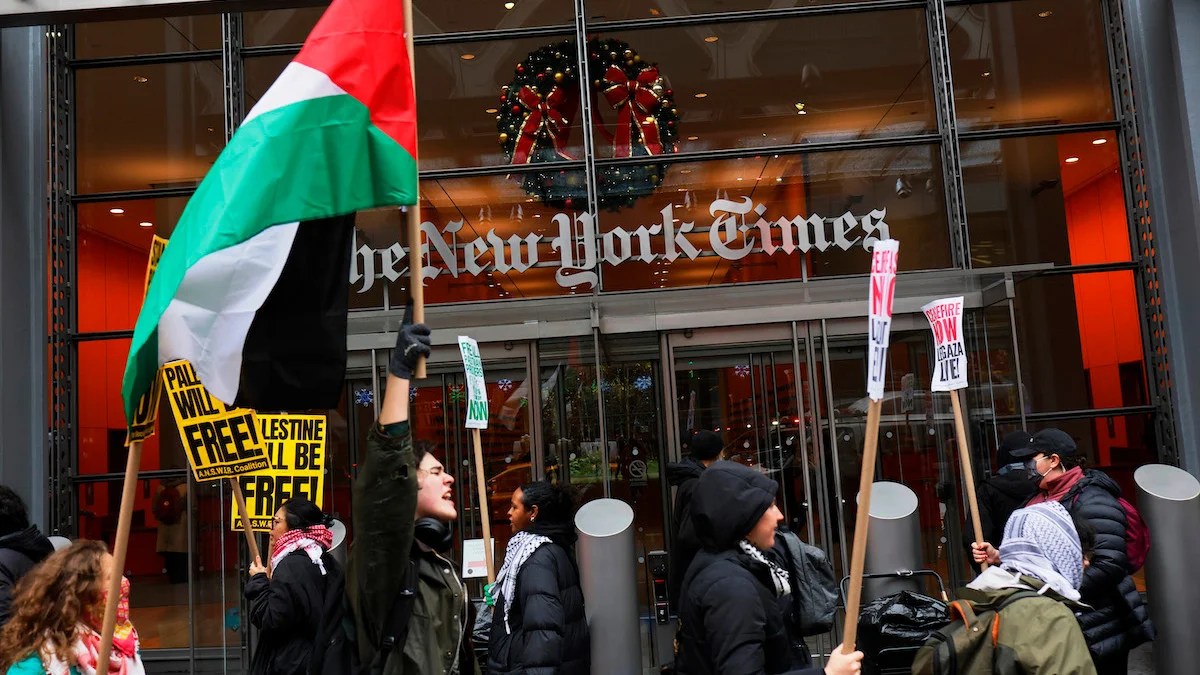 Pro-Palestinian protestors gather outside of the New York Times building to protest the newspaper’s coverage of the Israel-Hamas war in December 2023
