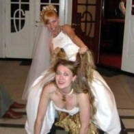 Bride on back of bridesmaid riding her down the aisle Funny Wedding Pictures Bad Wedding photos worst wedding pic ugly wedding dresses drunk bride groomsmen awkward family photos bad family bridesmaid dresses wedding receptions wedding djs russian wedding worst tattoos bad tattoos