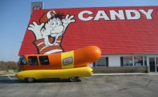 Oscar Meyer Weiner Mobil in front of Giant Candy Sign with boy, looks like penis ~ You have such a dirty mind