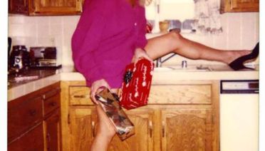 vintage family christmas photo 1980s, woman posing in kitchen trying to look sexy, holiday cards