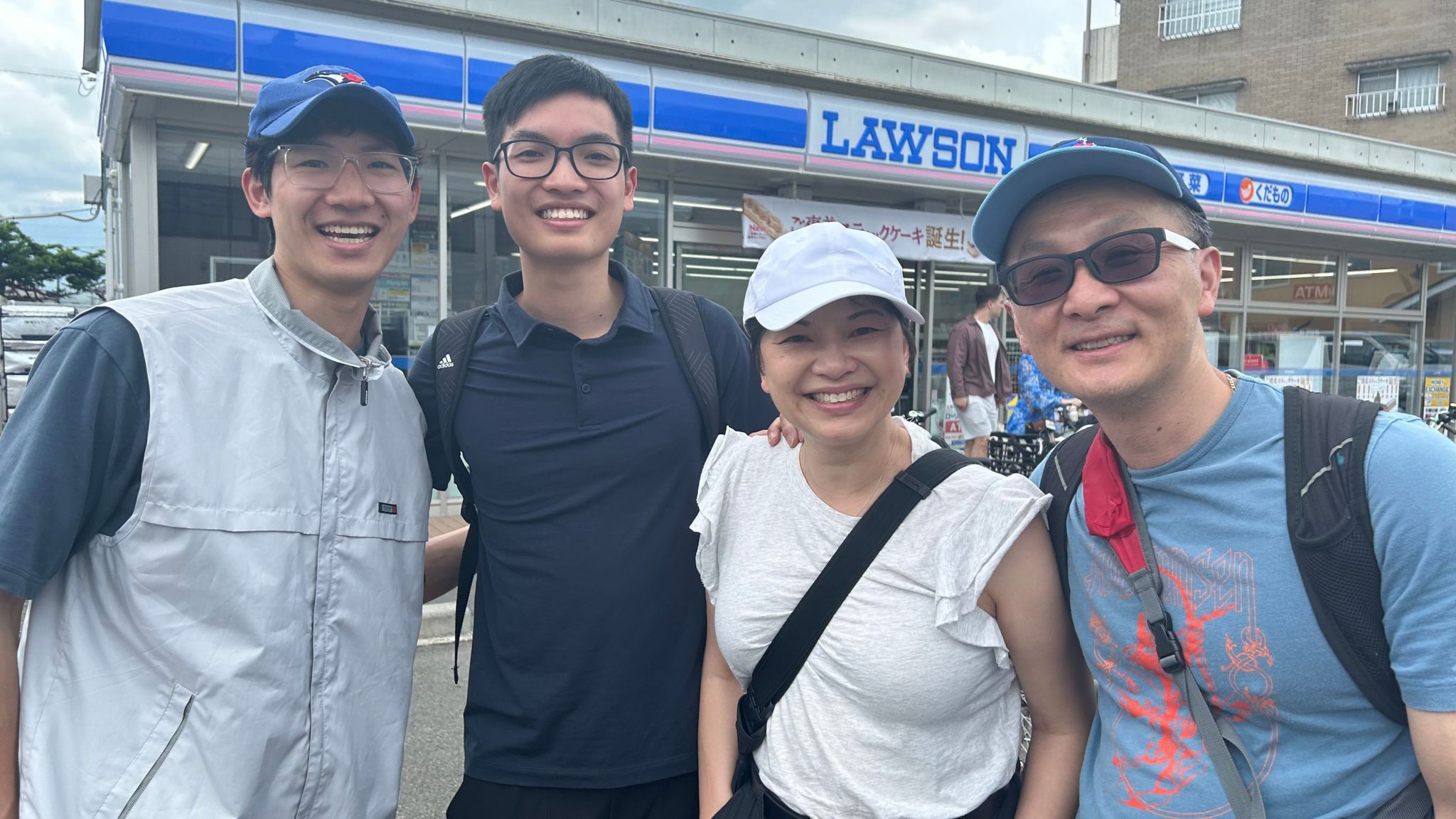 Wandy Chow and her family in front of the Lawson store