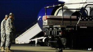 A transfer case containing the remains of a US soldier arrives at Dover Air Force Base