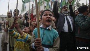 Young supporters of Jamaat-e-Islami, a religious and political party, yell anti-American slogans while protesting in Islamabad