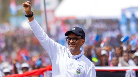 Incumbent President of Rwanda Paul Kagame waves to supporters during the launch of his presidential campaign in Musanze, Rwanda.