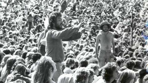 Black and white image of people at Knebworth in 1974