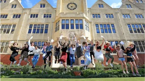 PA Girls jumping with A-level result papers - Roedean School