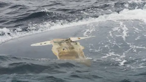 US Navy Upturned hull of the Cheeki Rafiki
