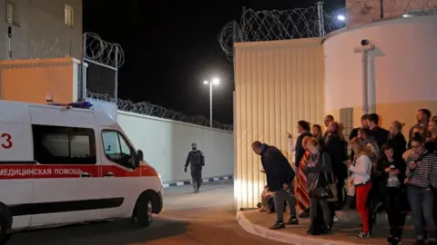 Reuters Ambulance drives into a detention centre in Minsk, 13 August 2020