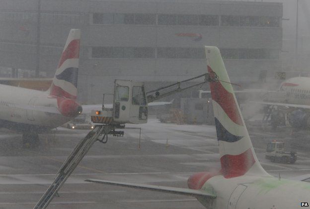 Planes being de-iced at Heathrow