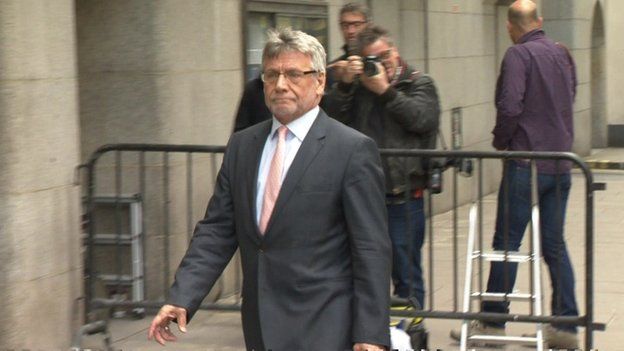 Former executive editor of the former British newspaper the News of the World, Neil Wallis, arrives at the Old Bailey in London on June 8, 2015