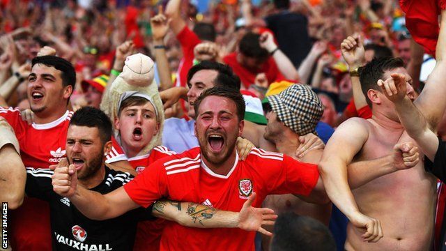 Wales fans celebrate a goal against Russia