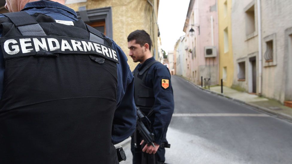 Police outside the raided flat in Montpellier (10 Feb)