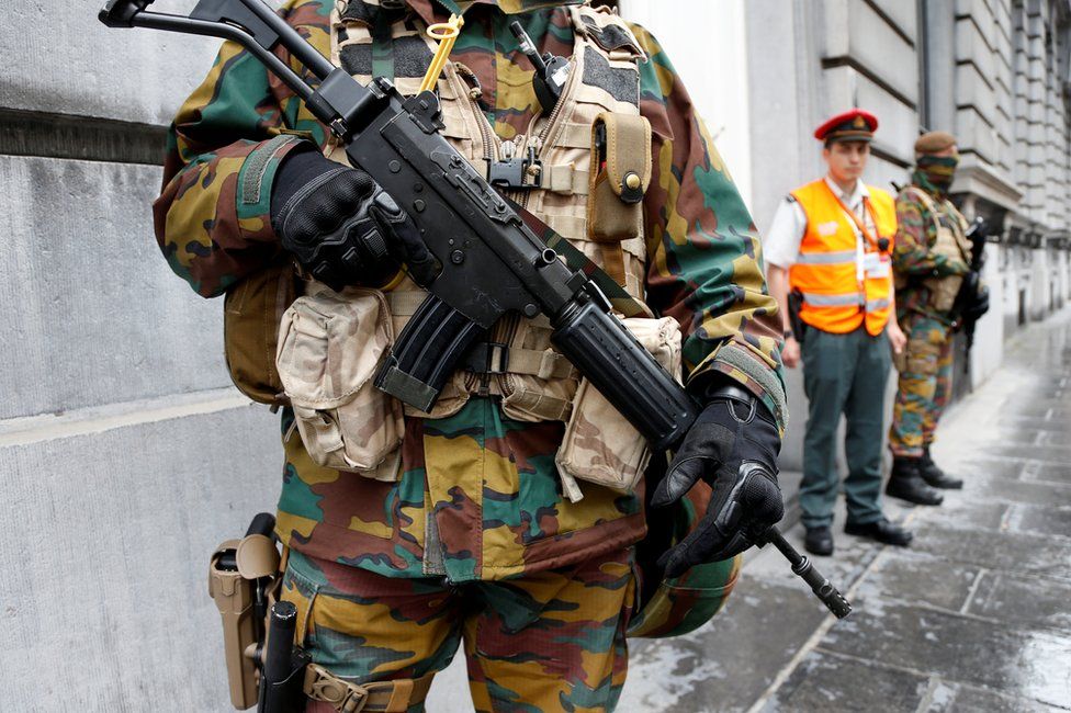 Soldiers guard the prime minister's office in Brussels, 18 June