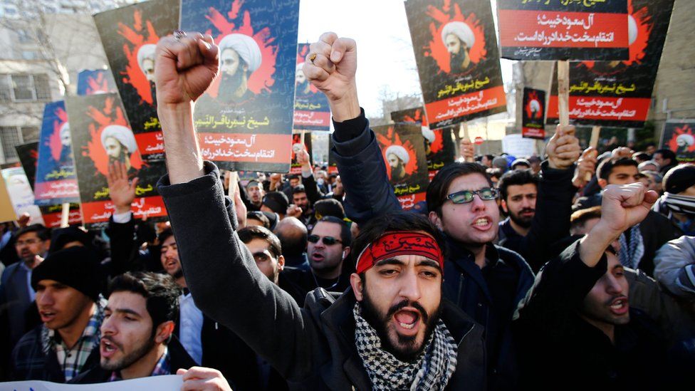 Iranian protesters hold posters of executed Shia cleric Nimr al-Nimr outside Saudi embassy in Tehran, 3 Jan 16
