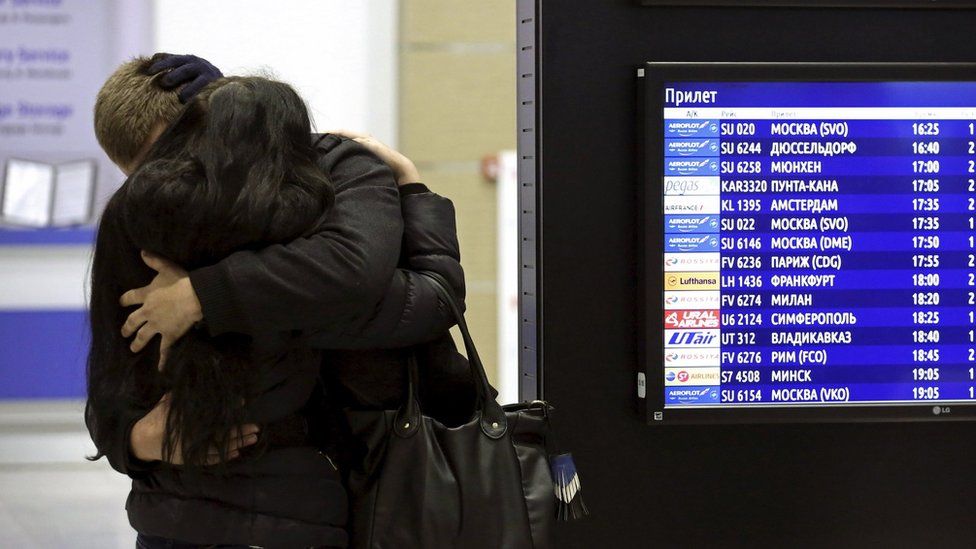 Relatives of passengers hug at Pulkovo airport, St Petersburg - 31 October