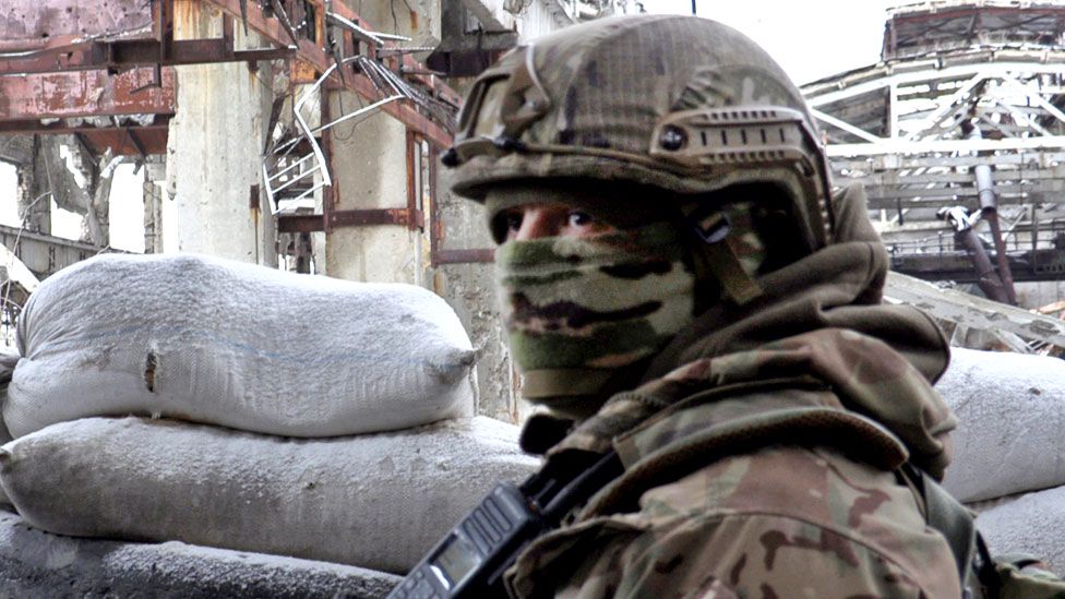 Ukrainian Military Forces standing guard at the destroyed industrial zone in town of Avdiivka