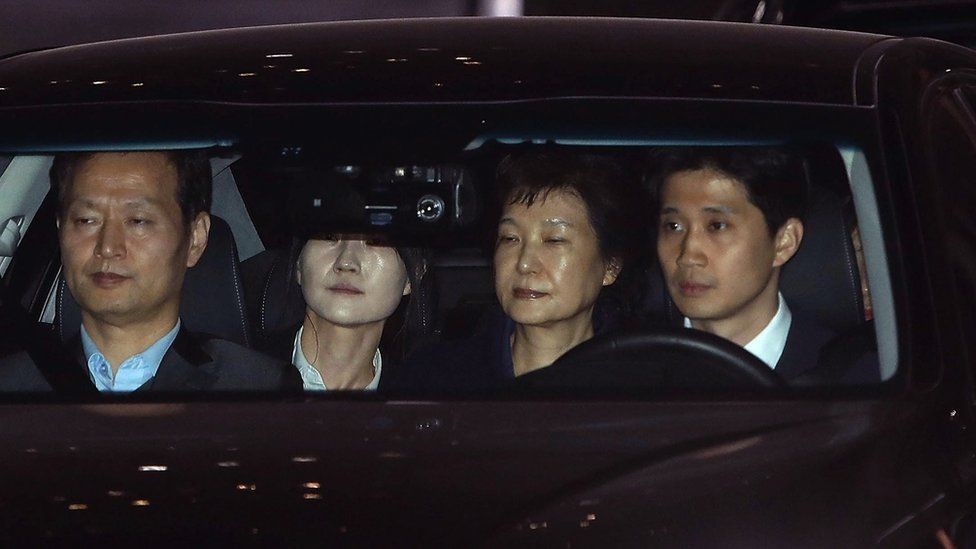 Ousted South Korean president Park Geun-hye leaves the prosecutors' office as she is transferred to a detention house in Seoul