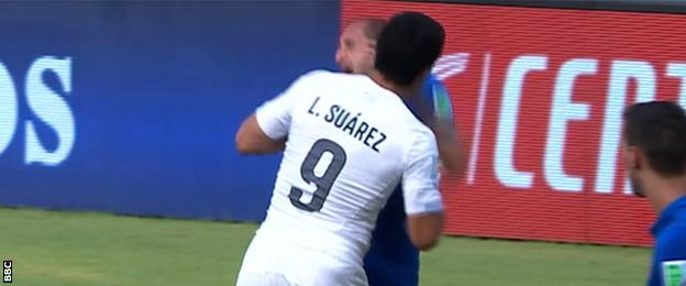 Luis Suarez appears to bite Giorgio Chiellini