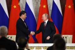 Poignée de main entre Xi Jingping et Vladimir Poutine