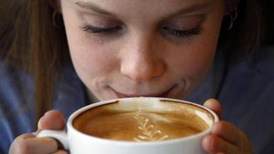 Young person drinks coffee