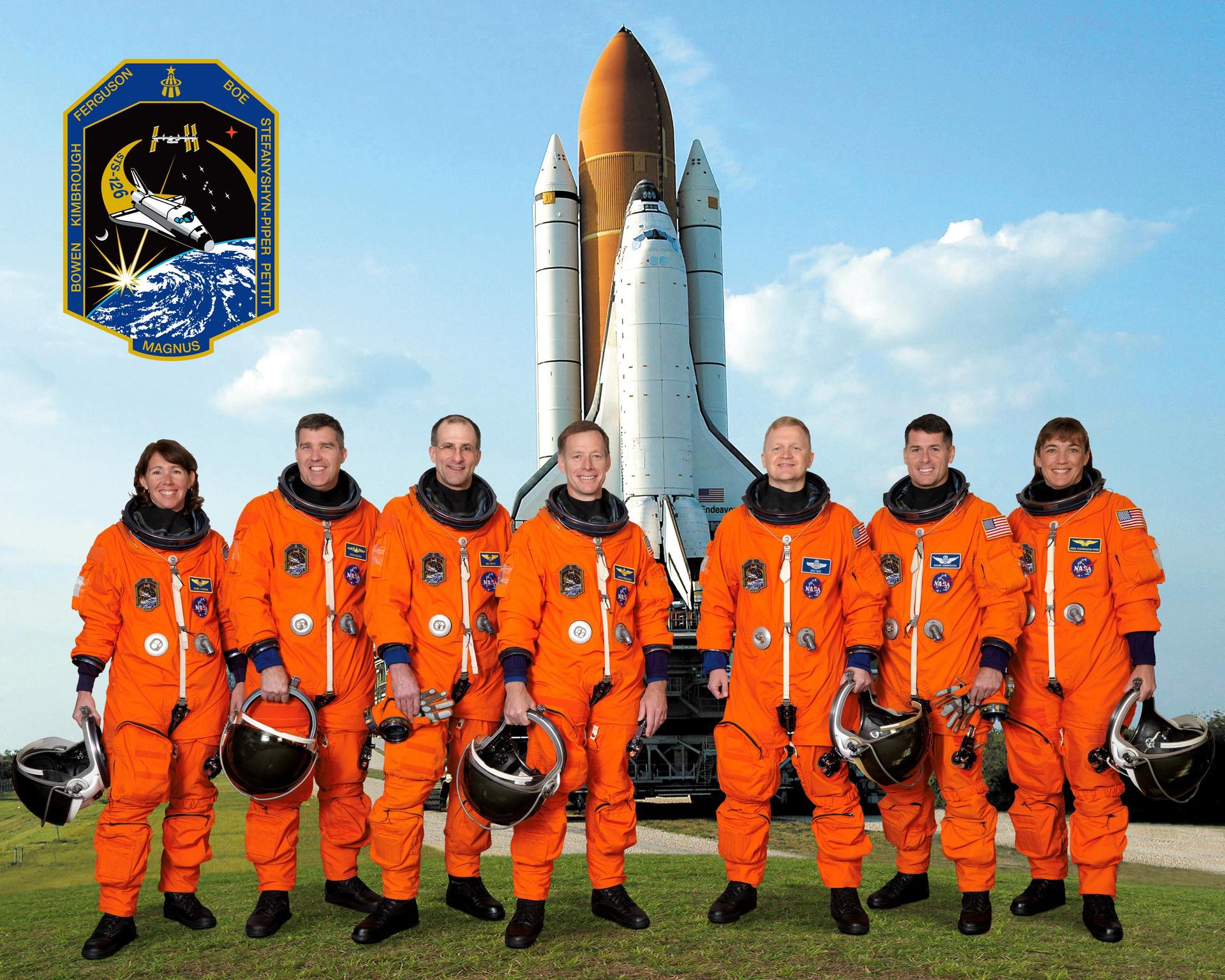 Attired in training versions of their shuttle launch and entry suits, the seven STS-126 crew members took a break from training to pose for the official crew portrait