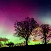 A strong solar storm creates a bright display of the northern lights at Beadnell in Northumberland.