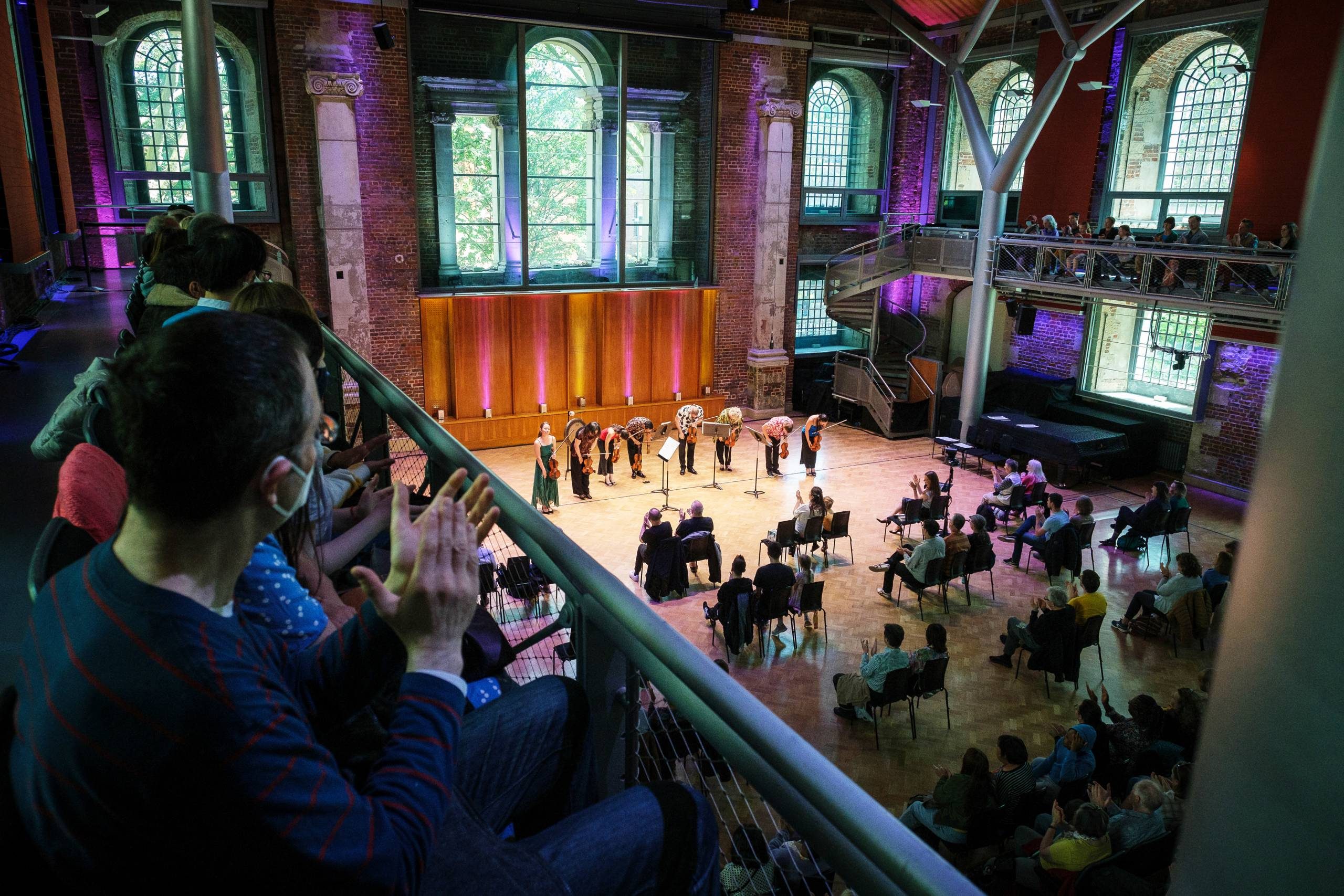An audience watches a performance from the Balcony in LSO St Luke's