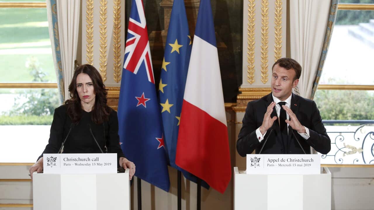 French President Emmanuel Macron (R) and New Zealand's Prime Minister Jacinda Ardern (L) 