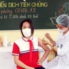 A student receives a COVID-19 vaccine shot in Quang Ninh province. (Photo: VNA)