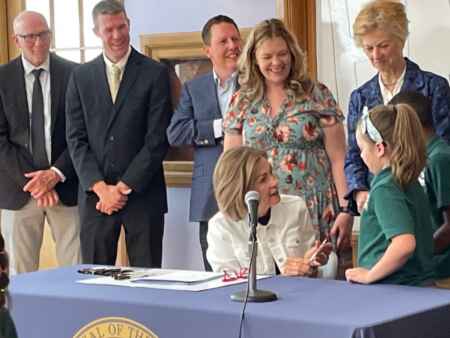 Iowa Gov. Kim Reynolds signs bill increasing funding for charter schools