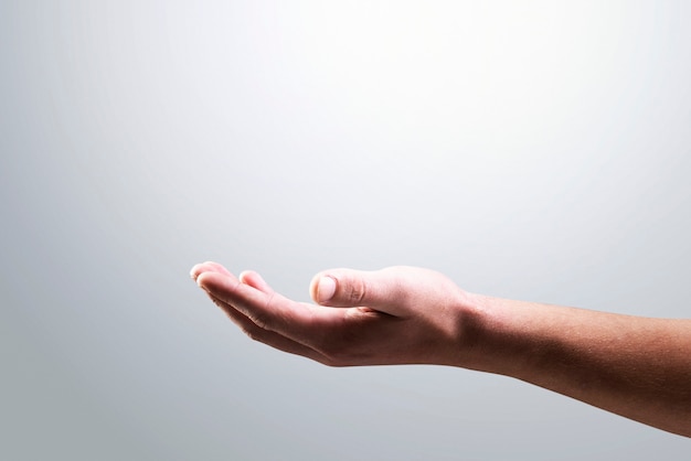 Free photo isolated hand background showing invisible object gesture