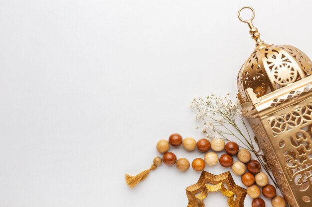 Islamic new year decoration with praying beads and lantern