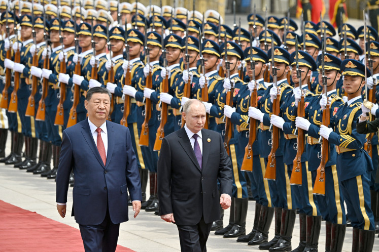 Chinese President Xi Jinping (left) and his Russian
counterpart Vladimir Putin attend an official welcoming ceremony on May 16, 2024, in
Beijing. In a joint press conference, Putin called for a political solution to Ukraine
while Xi proposed a two-state solution to the war in Gaza.