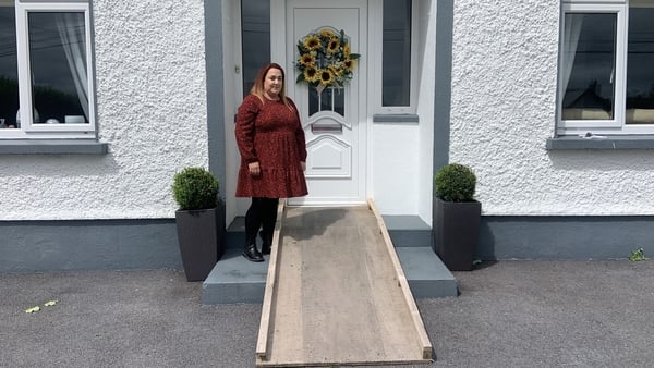 Joanne Greene with a ramp built by her uncle so her partner Keith can enter the house in his wheelchair