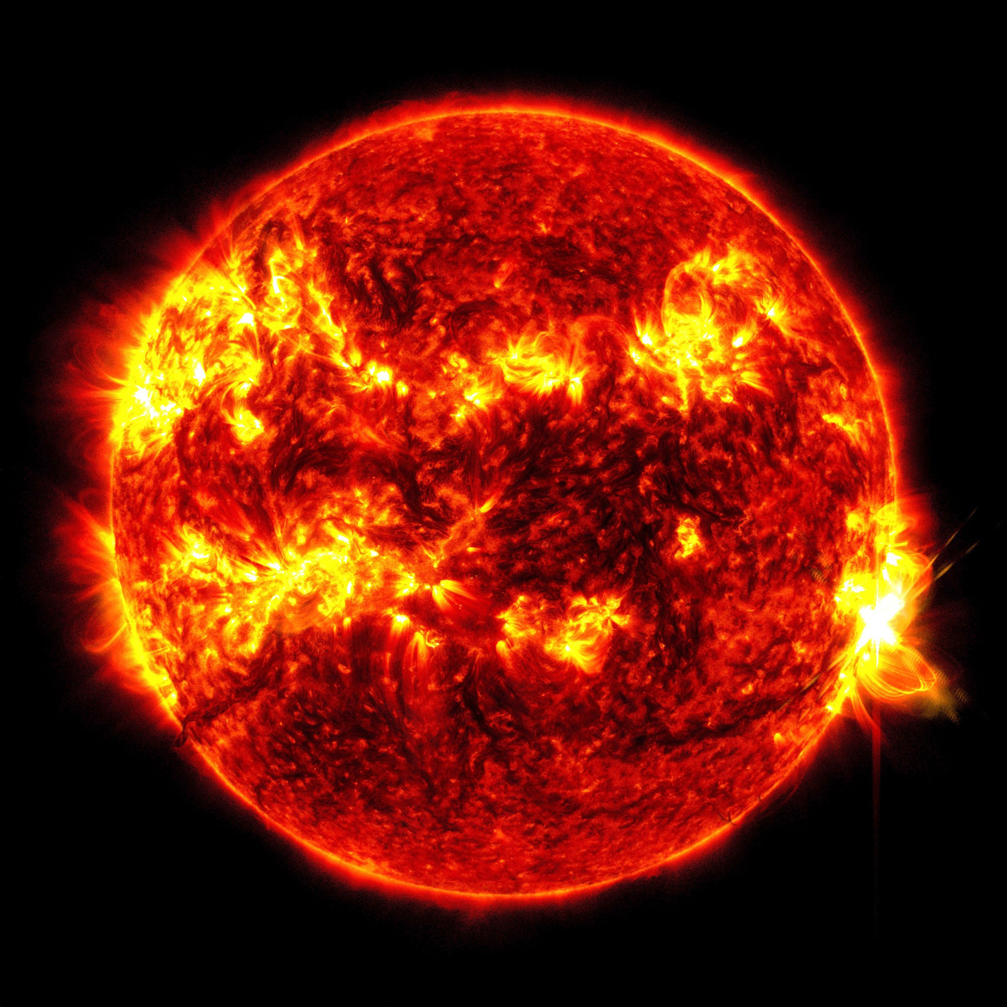 This image provided by NASA's Solar Dynamics Observatory shows a solar flare, the bright flash at right, on Tuesday, May 14, 2024. The sun produced its biggest flare in nearly a decade Tuesday, just days after a severe solar storm pummeled Earth and created dazzling northern lights in unaccustomed places. (NASA/SDO via AP)