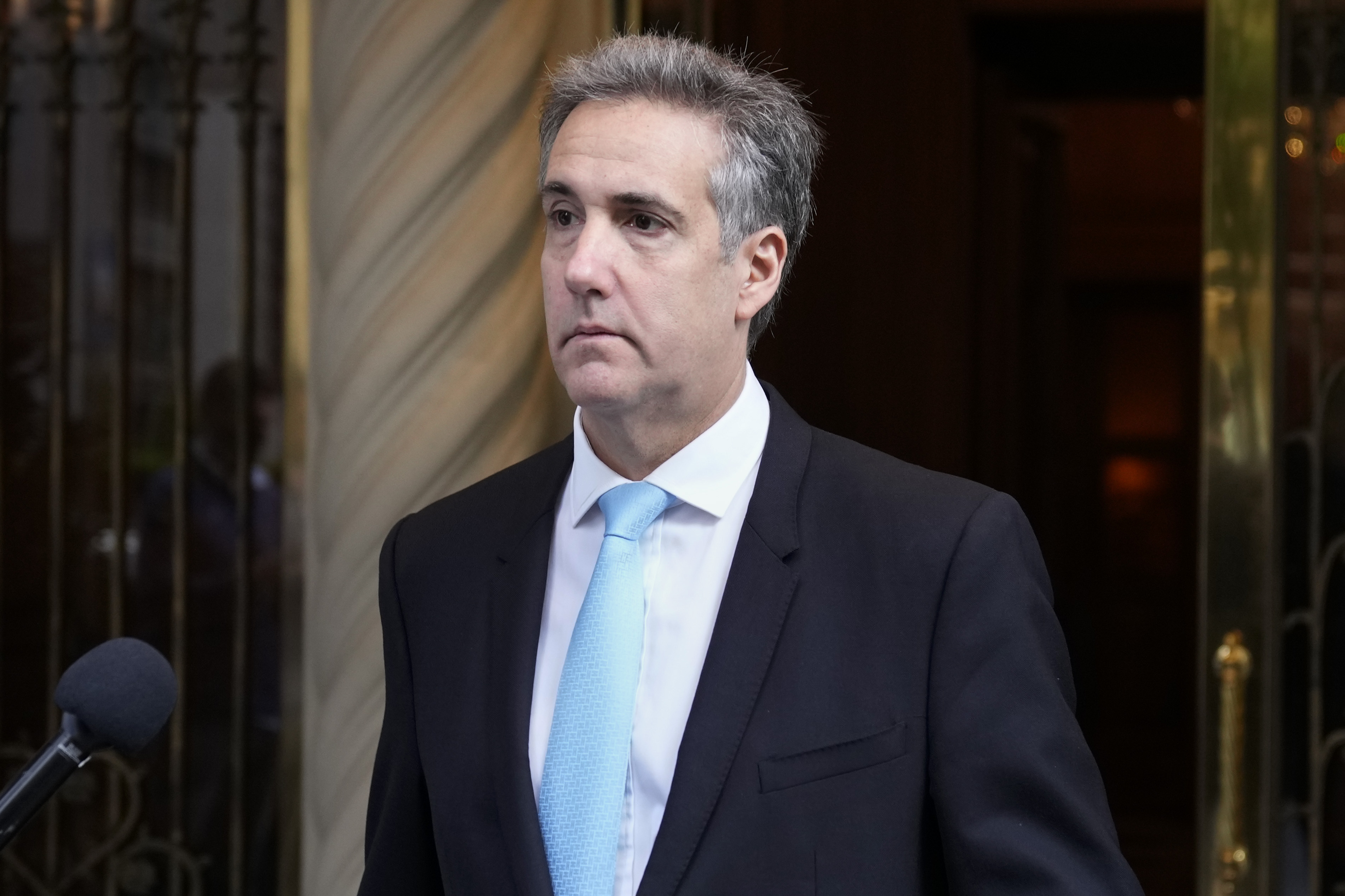 Michael Cohen leaves his apartment building on his way to Manhattan criminal court in New York, Tuesday, May 14, 2024. (AP Photo/Seth Wenig)