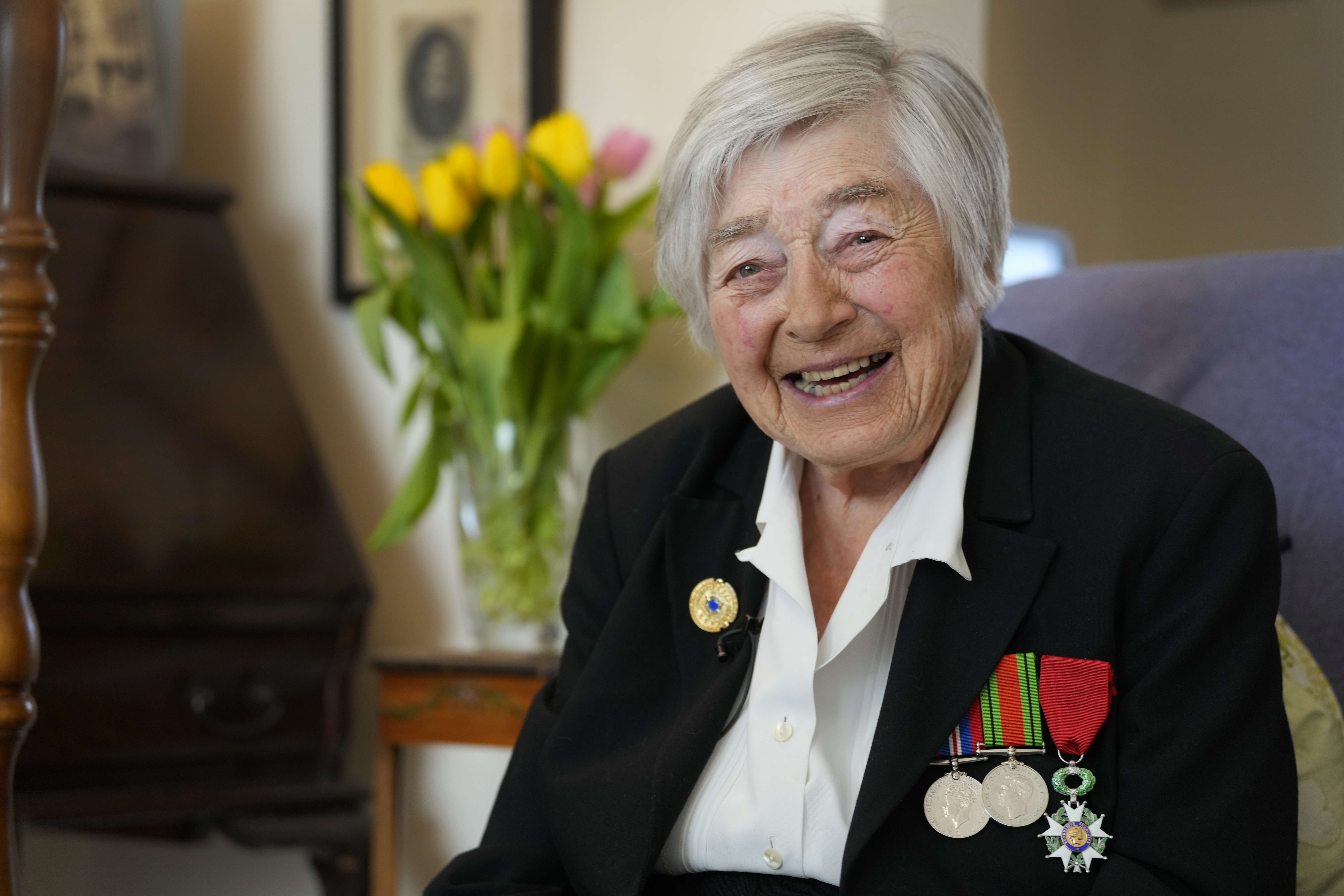 Patricia Owtram who was a serving Wren at the time of D-Day, at her home in London, Wednesday, April 10, 2024. D-Day, took place on June 6, 1944, the invasion of the beaches at Normandy in France by Alied forces during World War II. (AP Photo/Kirsty Wigglesworth)