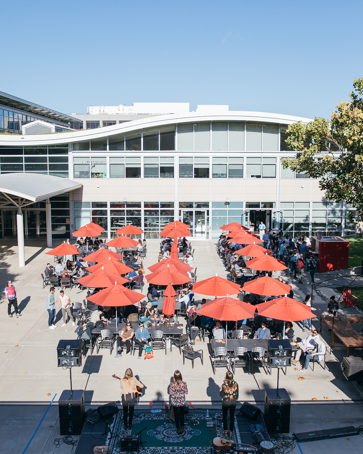 An aerial shot of the YouTube outdoor seating area, looking at the red patio umbrellas.